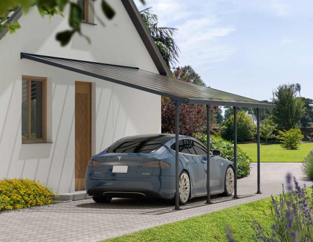 A blue Tesla is covered by a Grey Faria 13 ft. x 20 ft. lean-to carport