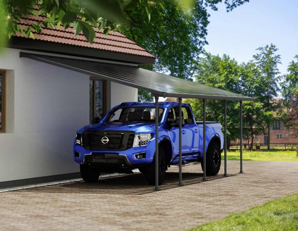 A blue truck is covered by a Grey Faria 13 ft. x 26 ft. lean-to carport