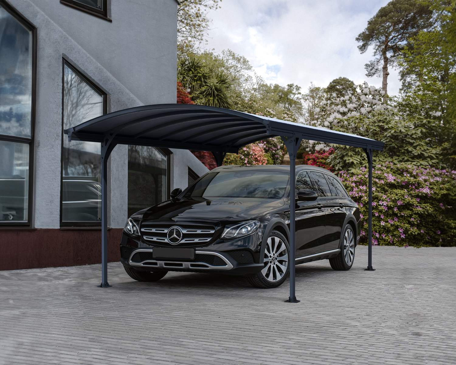 Sleek grey 10ft x 17ft Vitoria aluminum carport with a black car parked underneath, set in an outdoor setting