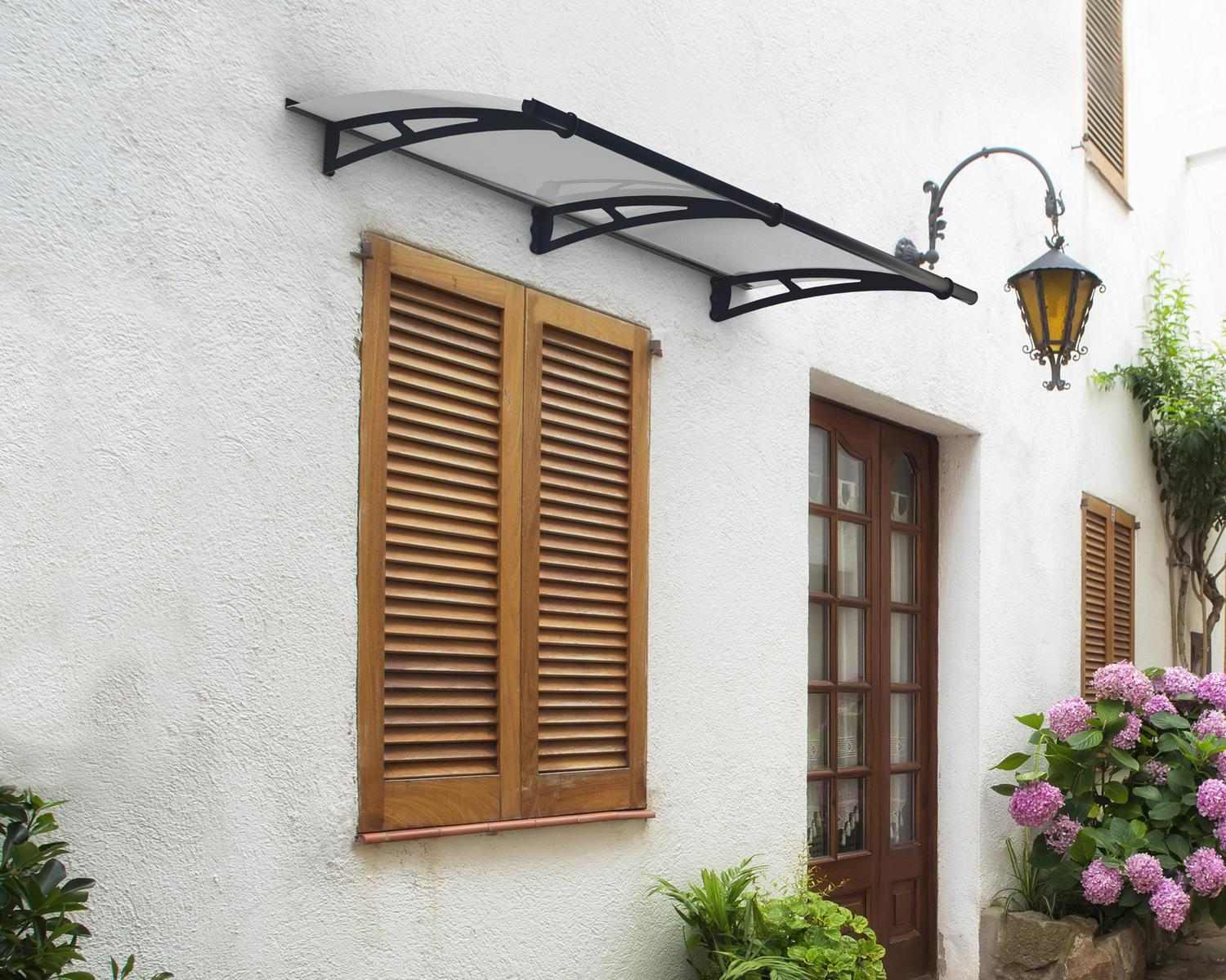 Grey Aquila door awning, 3 ft x 7 ft, featuring a clear roof, enhancing a modern entrance