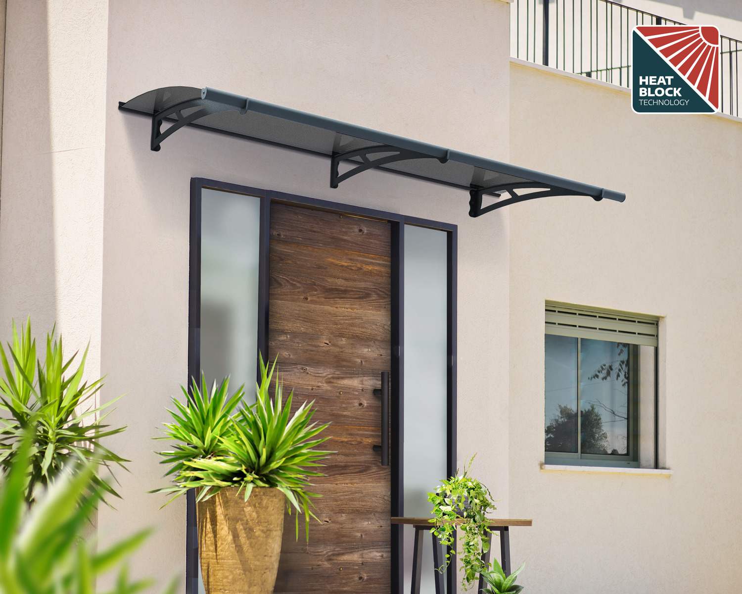 Grey Aquila door awning, 3 ft x 7 ft, with a solar grey roof and heat block technology, above a modern entrance