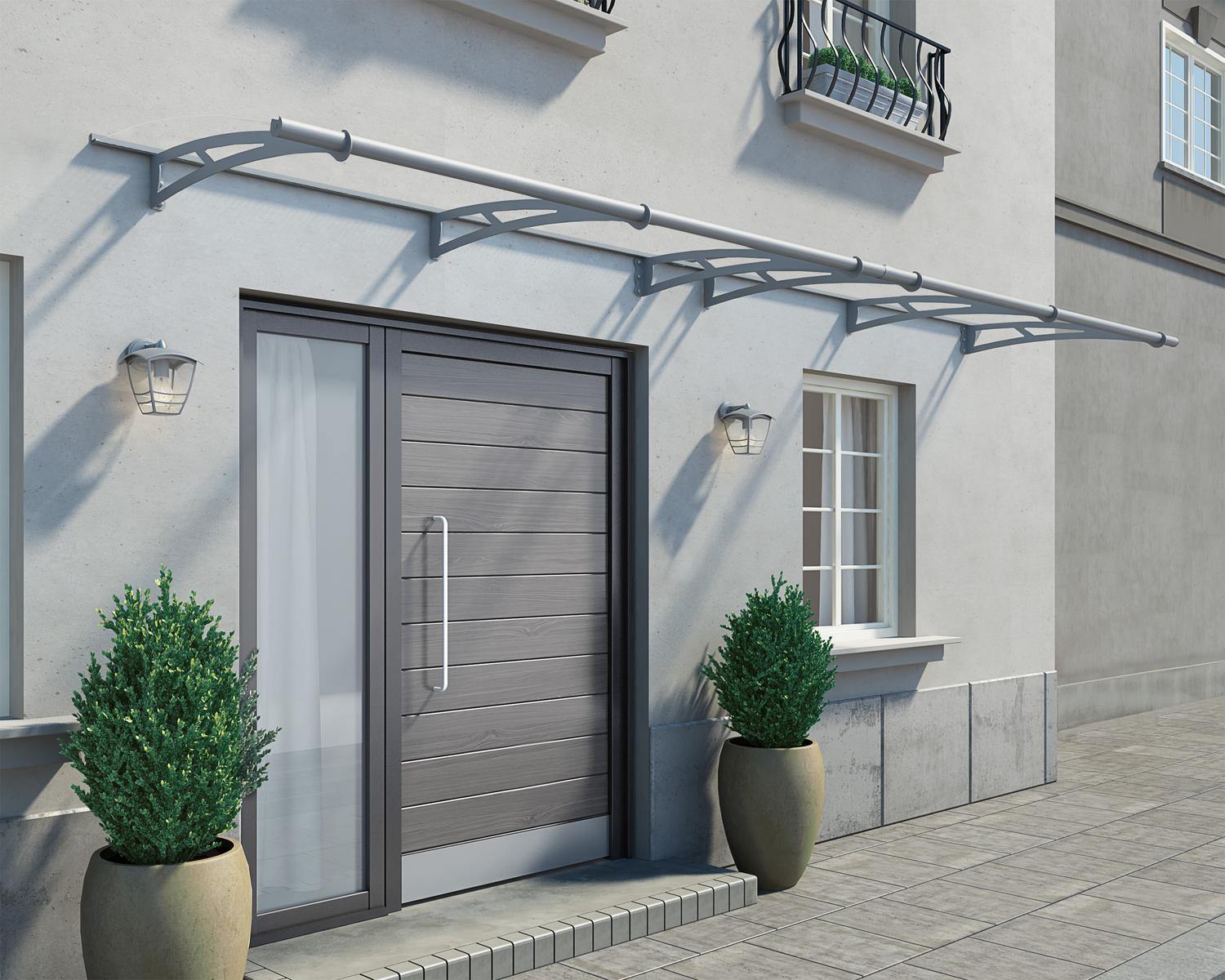 Modern silver Capella door awning 3 ft x 14 ft featuring clear panels, elegantly positioned above a door