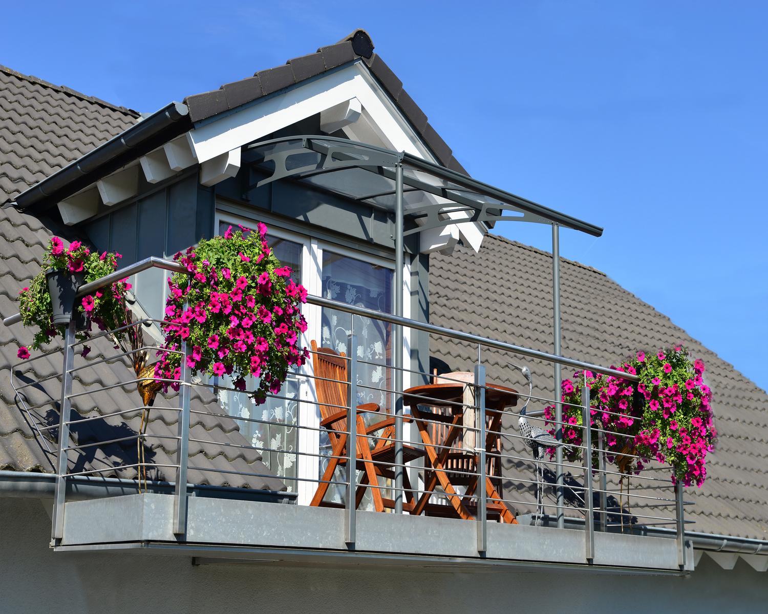 Sleek grey Vega door awning 7 ft x 7 ft featuring clear panels, stylishly positioned above a door for a contemporary look