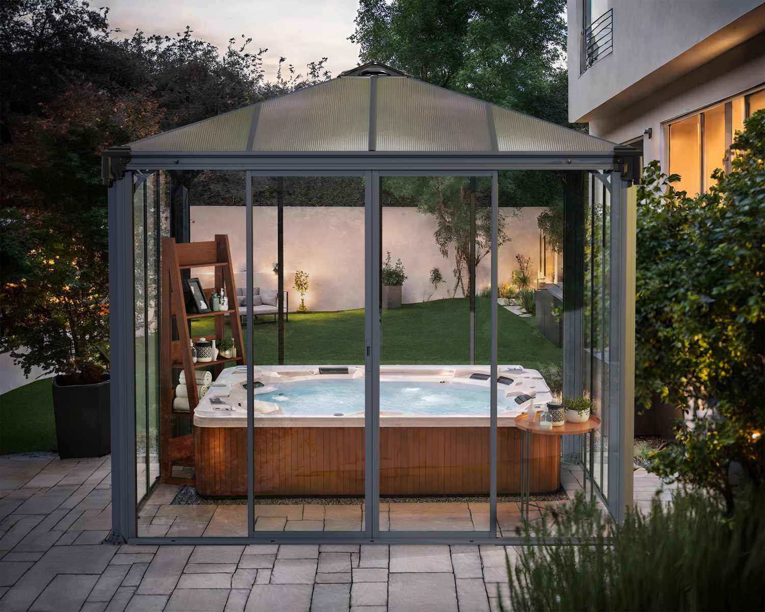 Ledro grey enclosed gazebo, 10 x 10 ft, featuring a modern design, outdoor hot tub, and ambient garden lighting