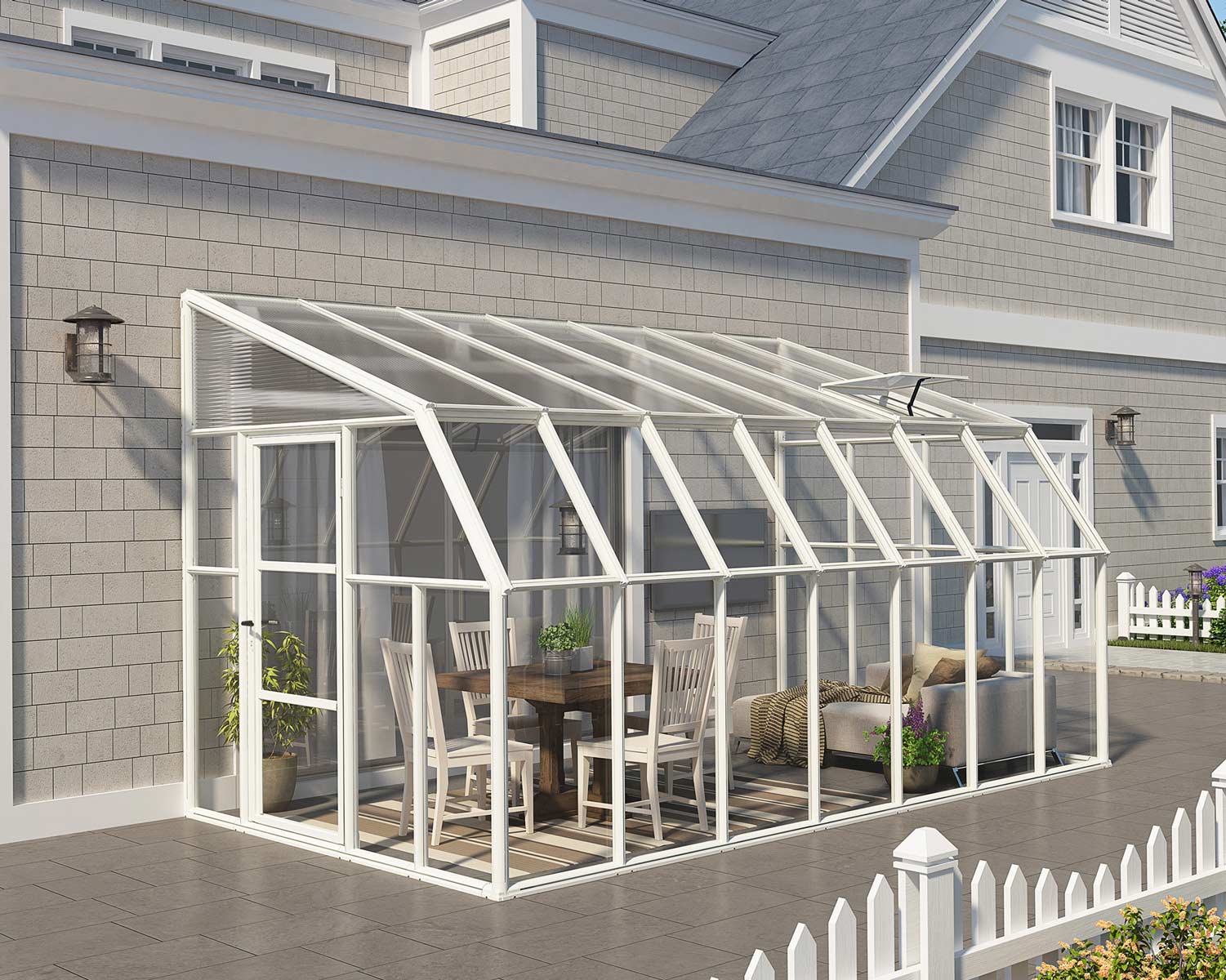 8ft x 14ft white enclosed gazebo SunRoom with clear polycarbonate panels and aluminum frame, attached to a house, with dining furniture