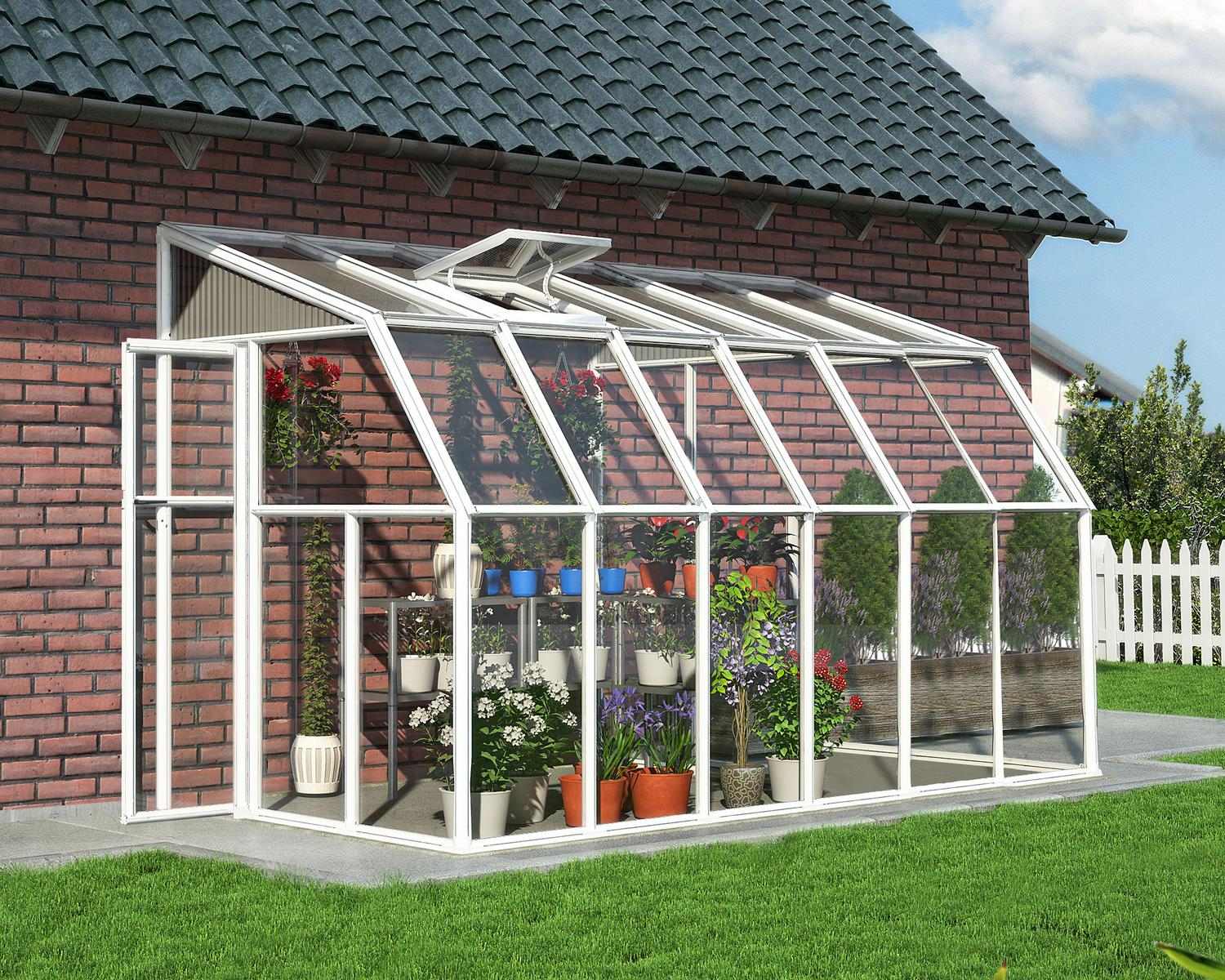 White sunroom gazebo with a clear panel, 6 ft x 12 ft, adjacent to a brick house and set amidst a lush green lawn