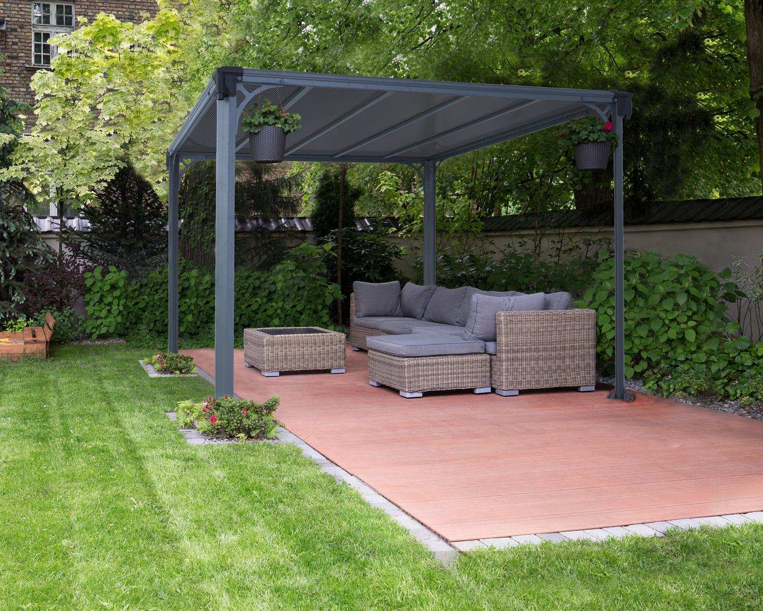 Milano 10ft x 10ft grey aluminum gazebo with a modern design, featuring a wicker sofa set surrounded by greenery
