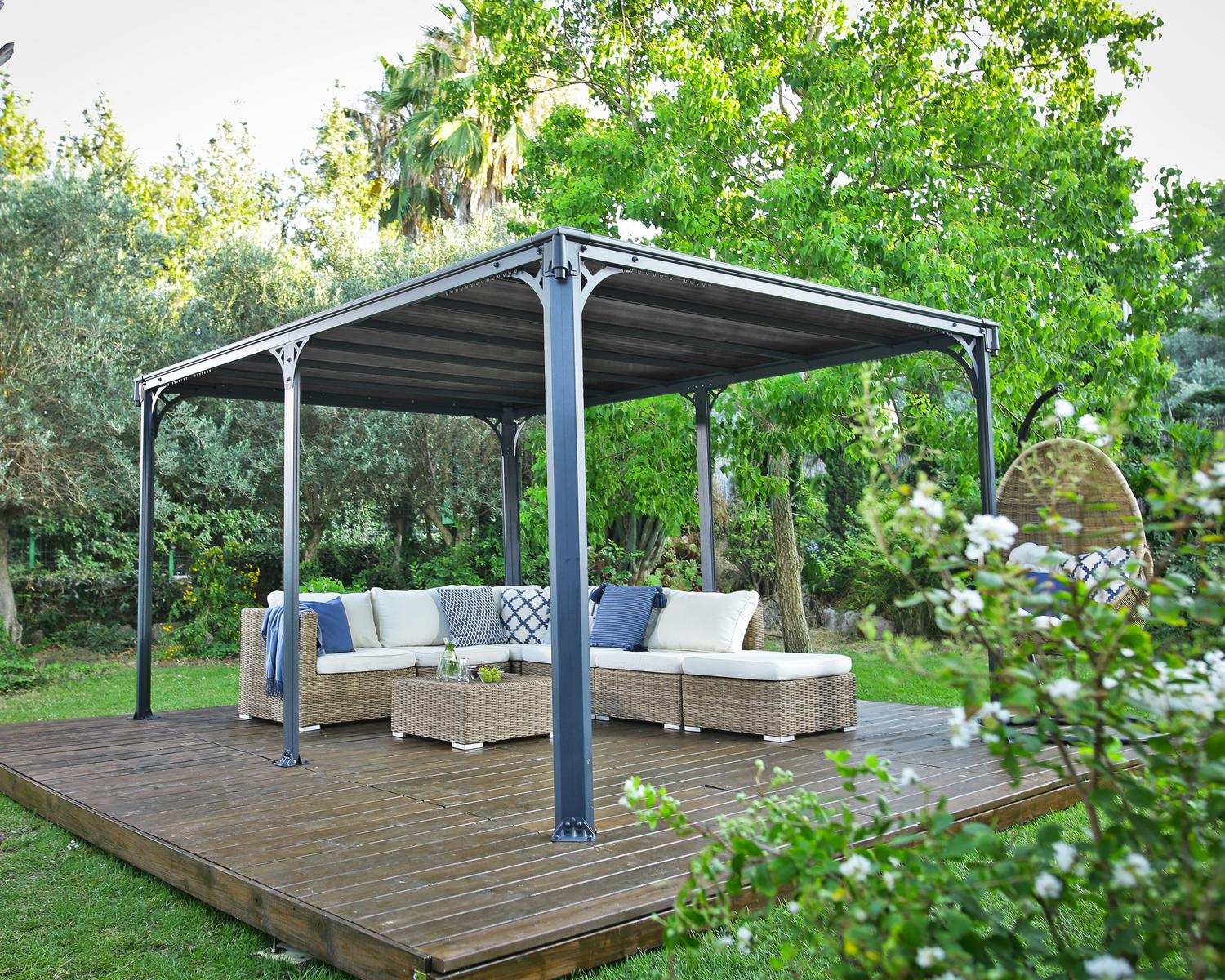 Milano 10ft x 14ft grey aluminum gazebo with a modern design, ideal for an outdoor dining area with string lights on a wooden deck