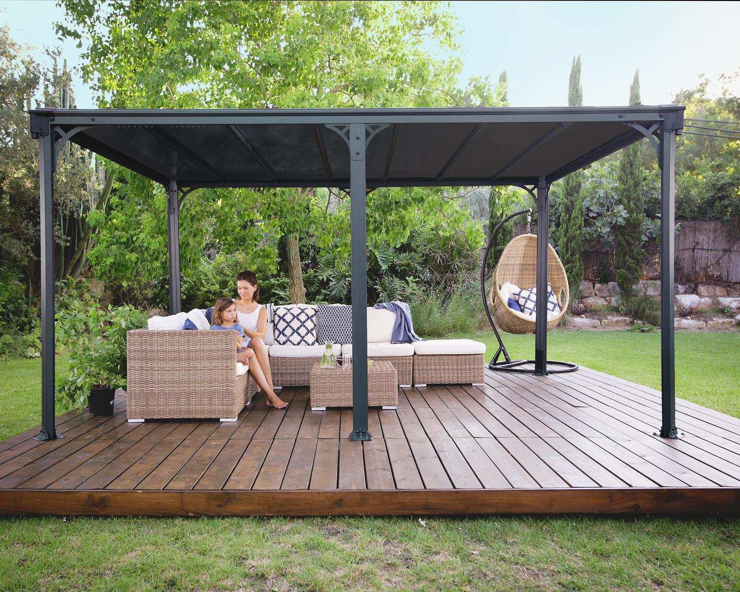 Milano 10ft x 14ft grey aluminum gazebo with a modern design, ideal for an outdoor dining area with string lights on a wooden deck