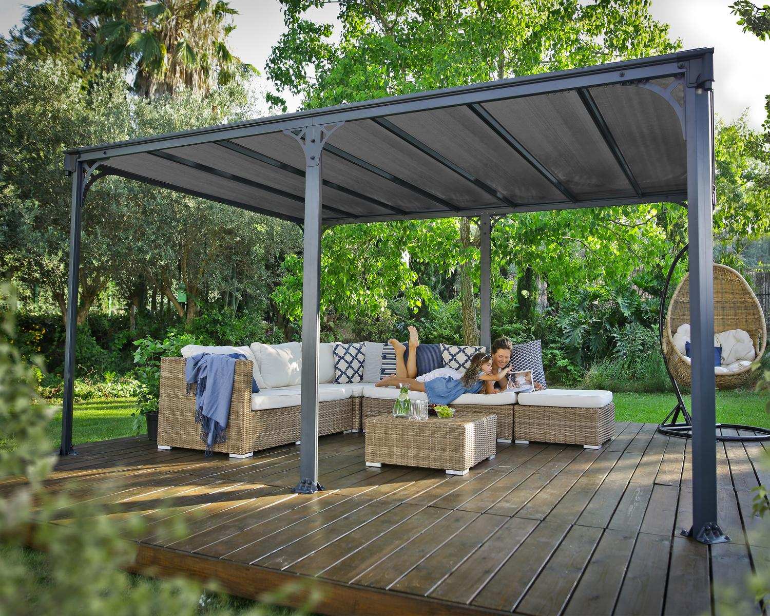 Milano 10ft x 14ft grey aluminum gazebo with a modern design, ideal for an outdoor dining area with string lights on a wooden deck