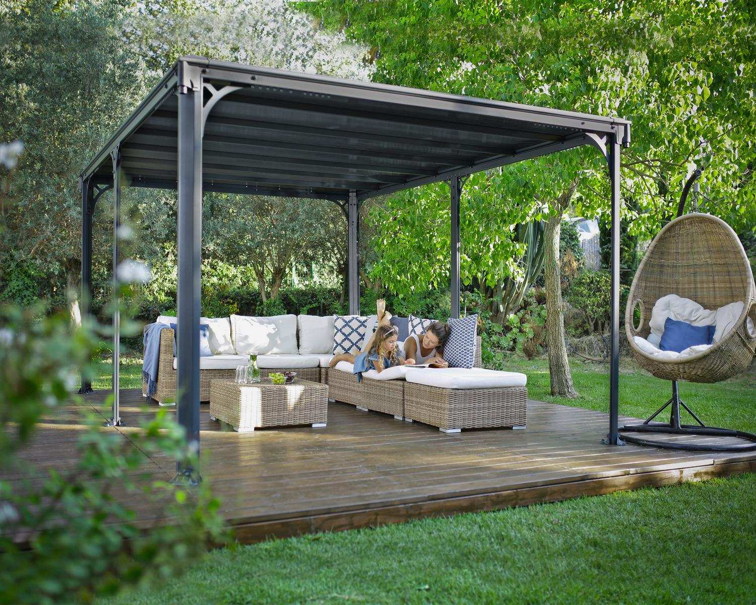 Milano 10ft x 14ft grey aluminum gazebo with a modern design, ideal for an outdoor dining area with string lights on a wooden deck