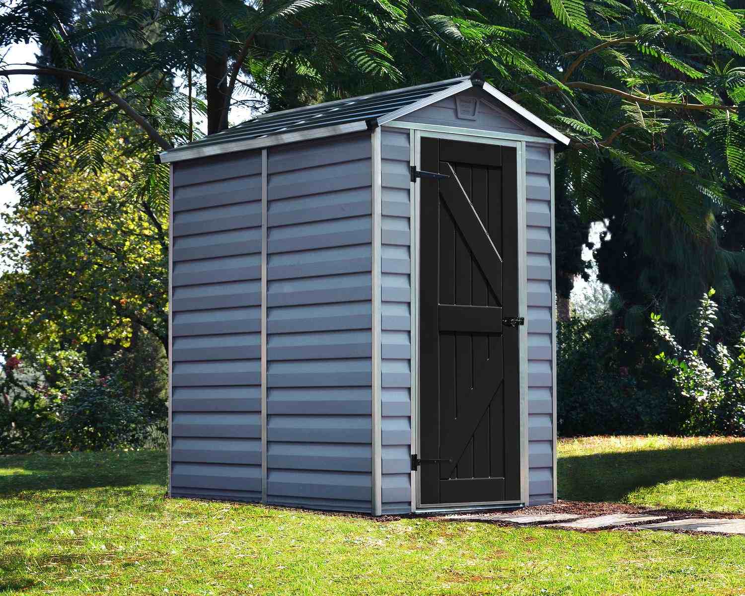 Dark grey Skylight plastic storage shed, 4 ft x 6 ft, with modern design and white trim, on a concrete base in a green backyard