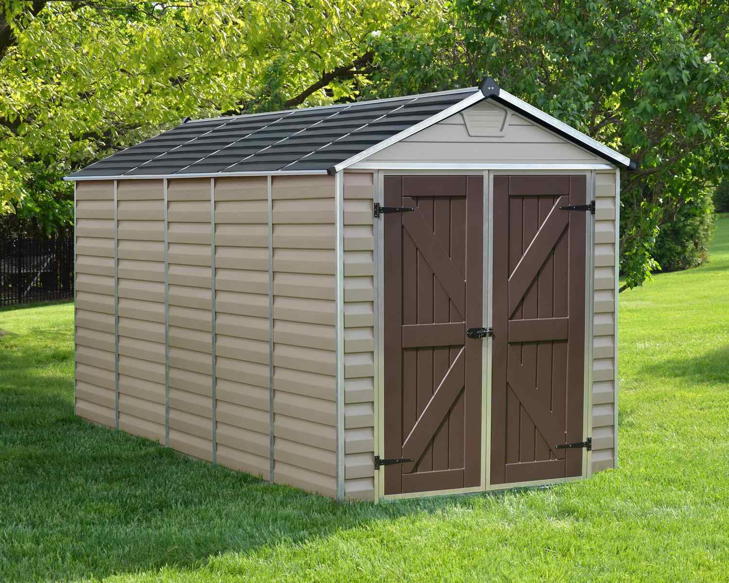 Skylight Plastic Storage Shed 6ft x 12ft in Tan, boasting a sleek, modern design, nestled in a backyard surrounded by vibrant greenery