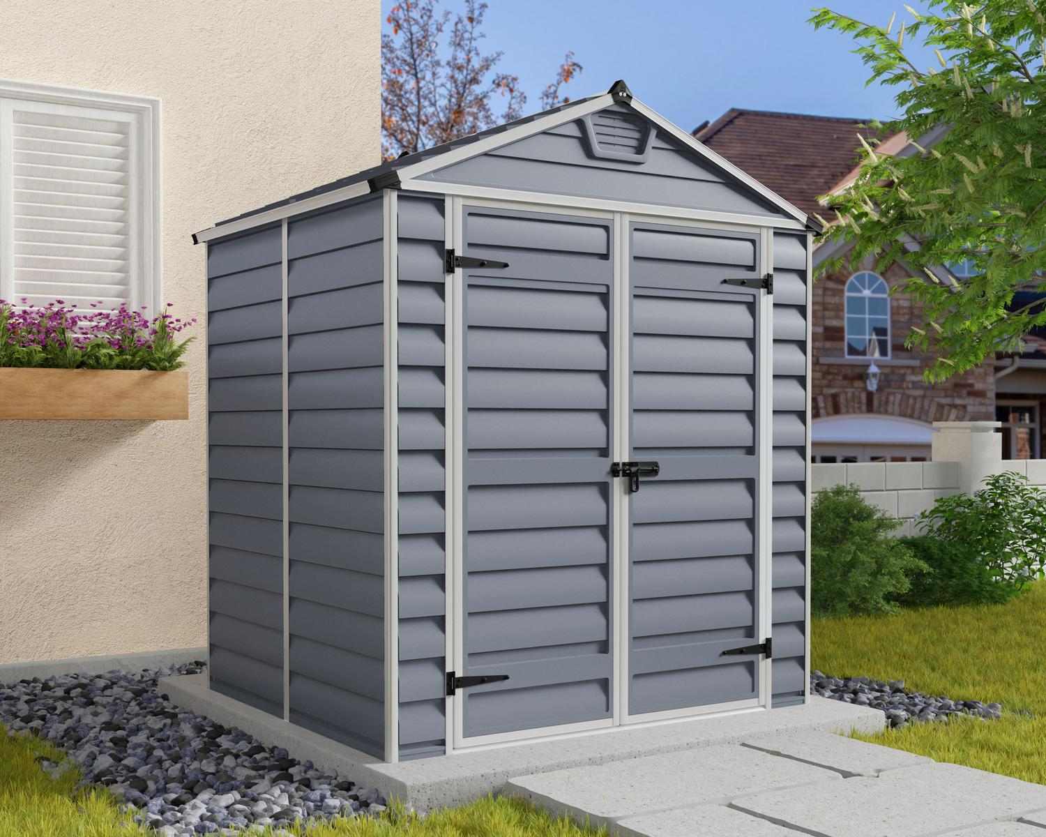 Dark grey skylight plastic storage shed, measuring 6 ft x 5 ft, with a modern design set in a green outdoor area