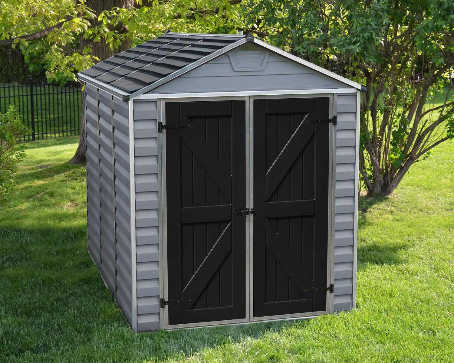 Grey skylight plastic storage shed, measuring 6 ft x 8 ft, featuring a sleek design in an outdoor setting with greenery