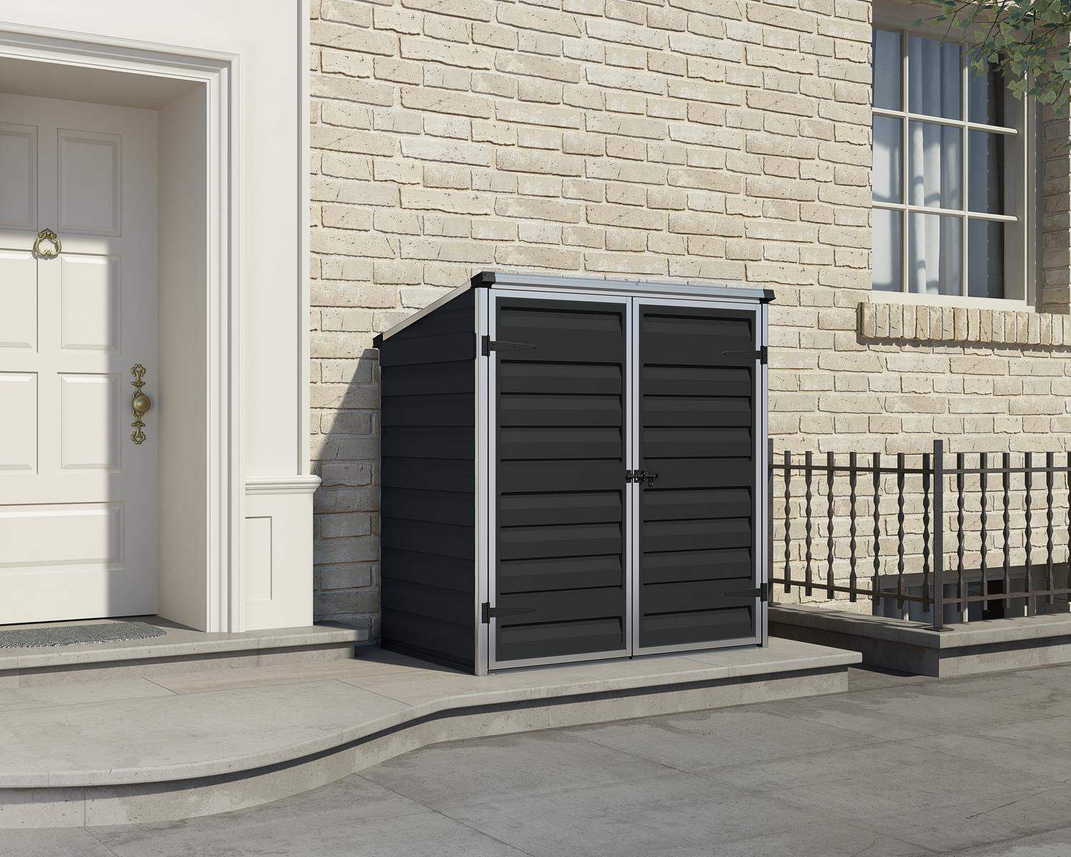 Voyager Plastic Storage Shed 2ft x 4ft in Midnight Grey, with a spacious interior, set in a vibrant outdoor setting