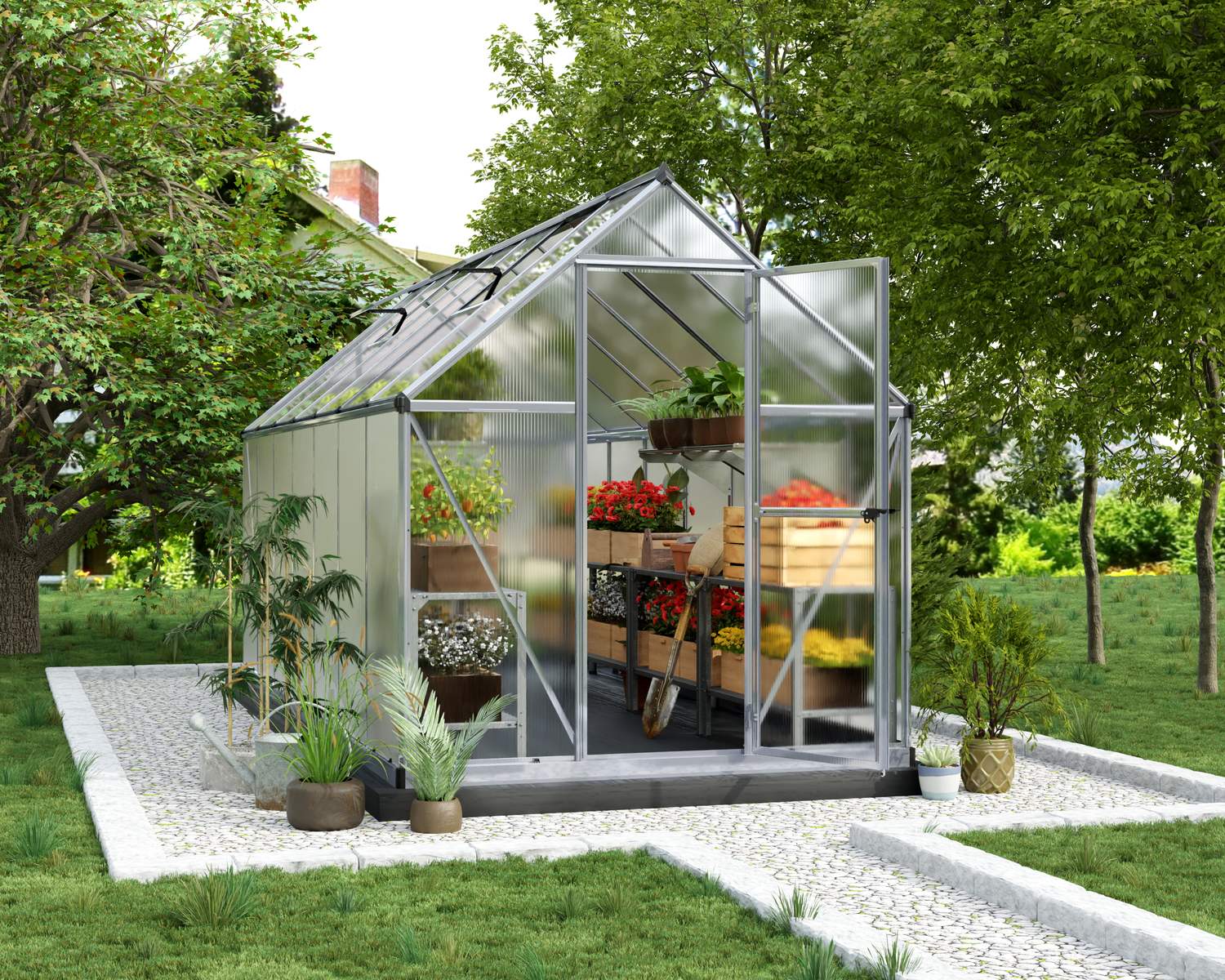 6ft x 14ft silver Mythos greenhouse with an aluminum frame and clear polycarbonate panels, set in a garden surrounded by greenery