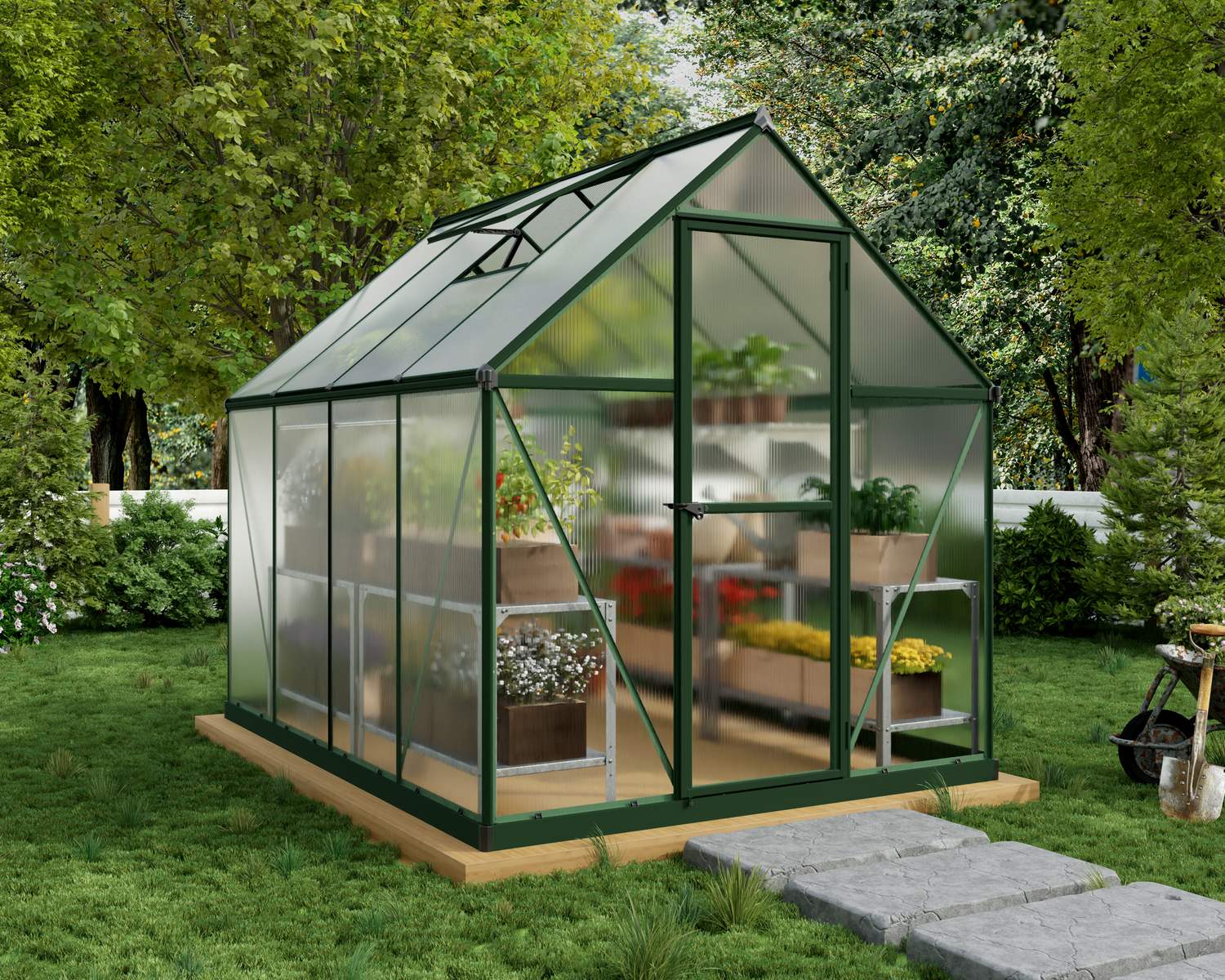 6ft x 8ft green Mythos greenhouse with a durable aluminum frame and clear polycarbonate panels, featuring plant shelves in a lush garden