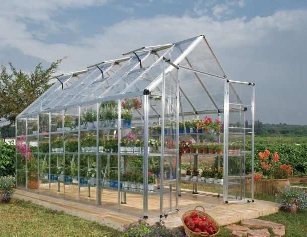 Snap &amp; Grow Greenhouse Silver Structure &amp; Clear Panels on a lawn