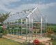 Snap &amp; Grow Greenhouse Silver Structure &amp; Clear Panels on a lawn