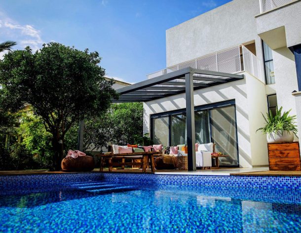 Grey Aluminium Patio Cover With Clear twin-wall polycarbonate roof panels on Beside Pool Patio protect garden furniture