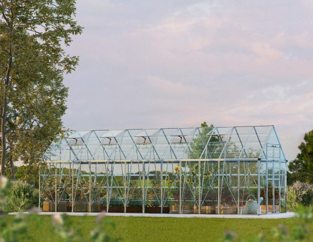 Snap &amp; Grow 8 ft. x 24 ft. Greenhouse Silver Structure &amp; Clear Panels on a lawn side view