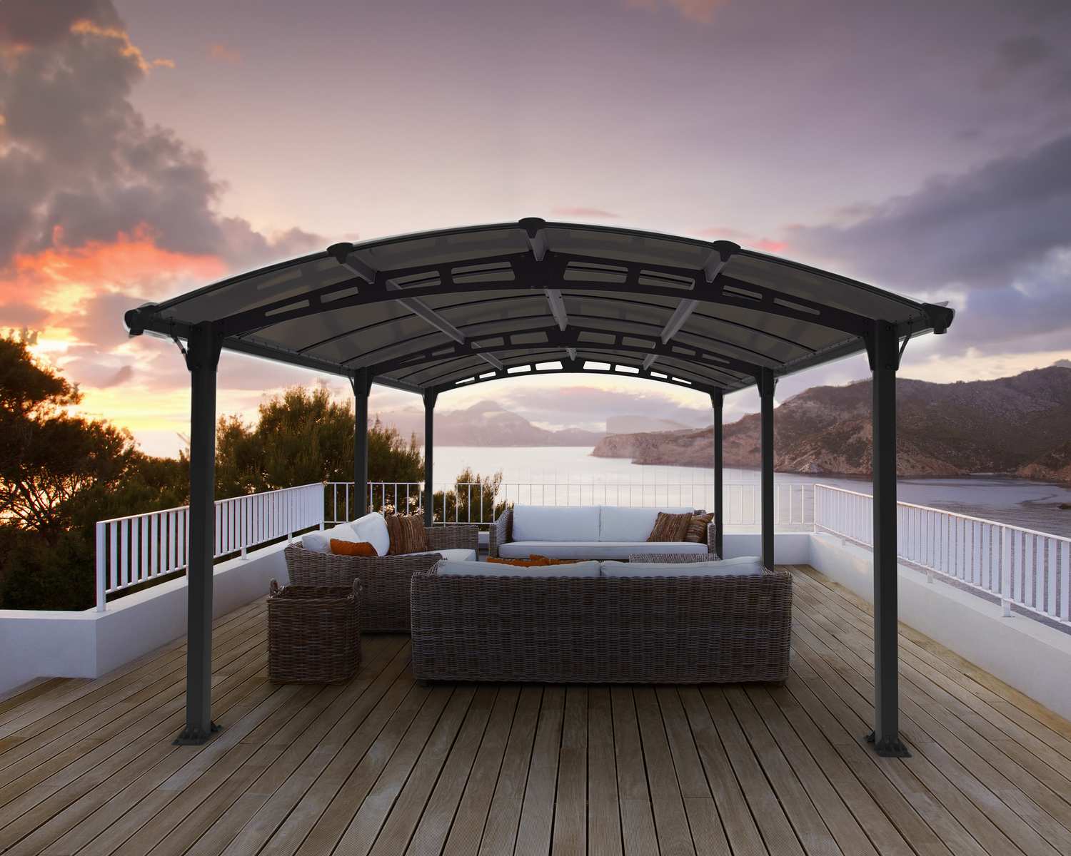Tucson 12ft x 17ft grey aluminum gazebo on a seaside wooden deck with a sofa and sunset view over the mountains