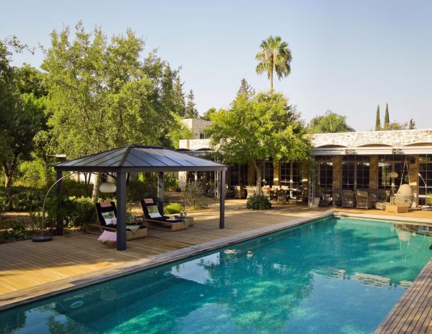 Poolside aluminium gazebo with garden furniture