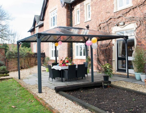 Outdoor Aluminium gazebo with polycarbonate roof panels on a garden patio