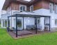 Aluminum grey gazebo Martinique 12'x16' with polycarbonate roof panels lean to house on a deck patio with garden furniture