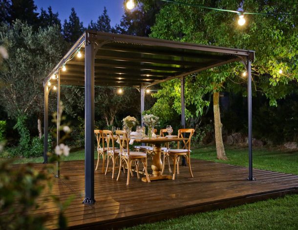 Milano 10&#039; x 14&#039; gazebo with lighting on a deck patio with dining furniture