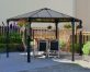 Hexagon gazebo on a concrete patio with dining furniture