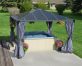 12&#039;x12&#039; hot tub aluminum gazebo with polycarbonate roof panels and privacy curtains to cover a hot tub on a concrete patio