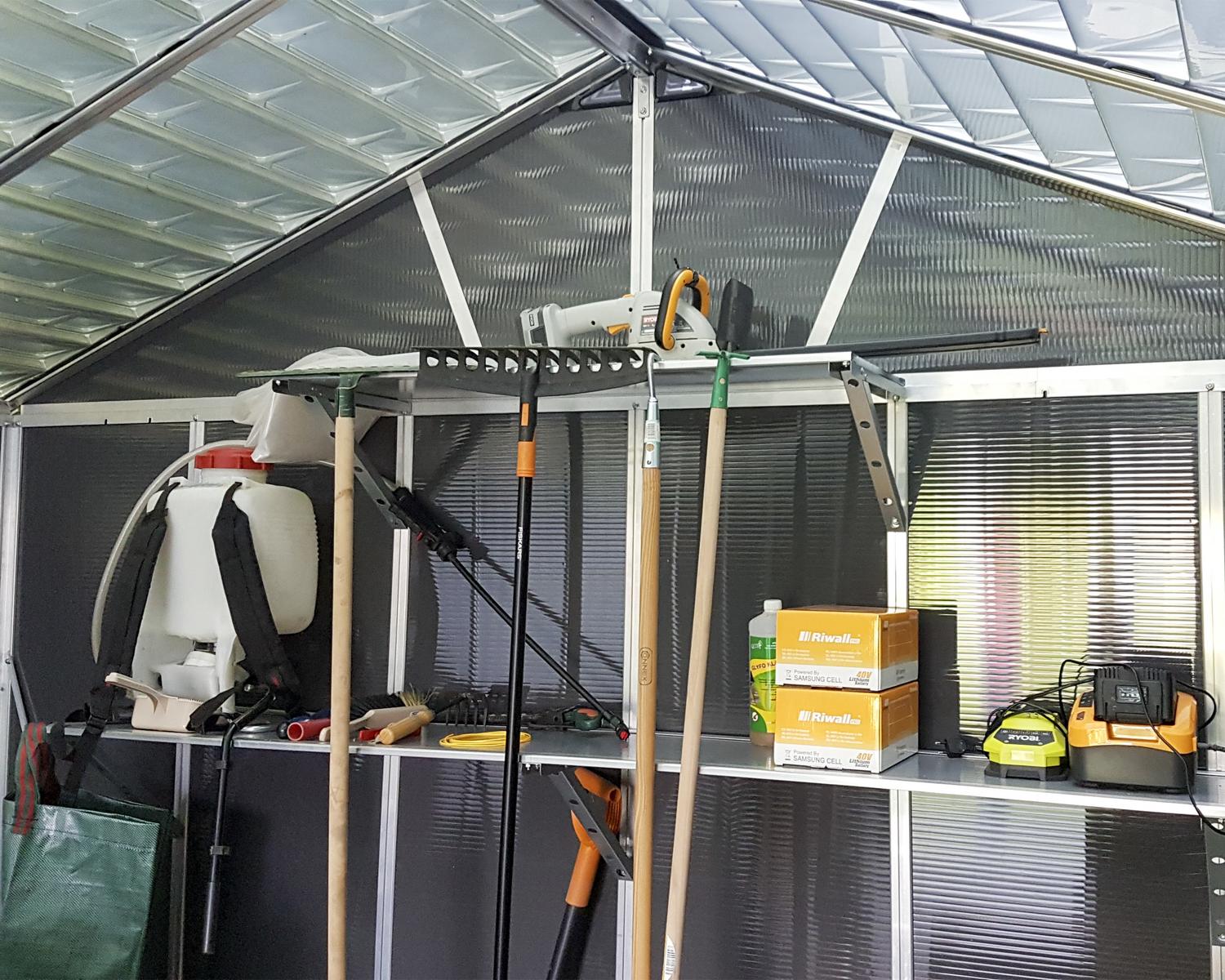 Organizing of tools in 11' x 17.2' plastic storage shed with a skylight roof