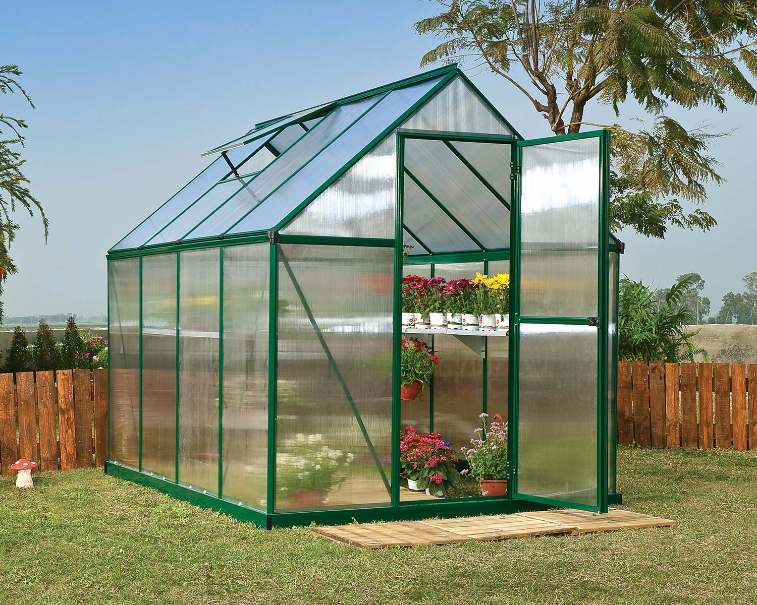 Mythos 6&#039; x 8&#039; Greenhouse Green Structure &amp; Twinwall Panels outside on a lawn