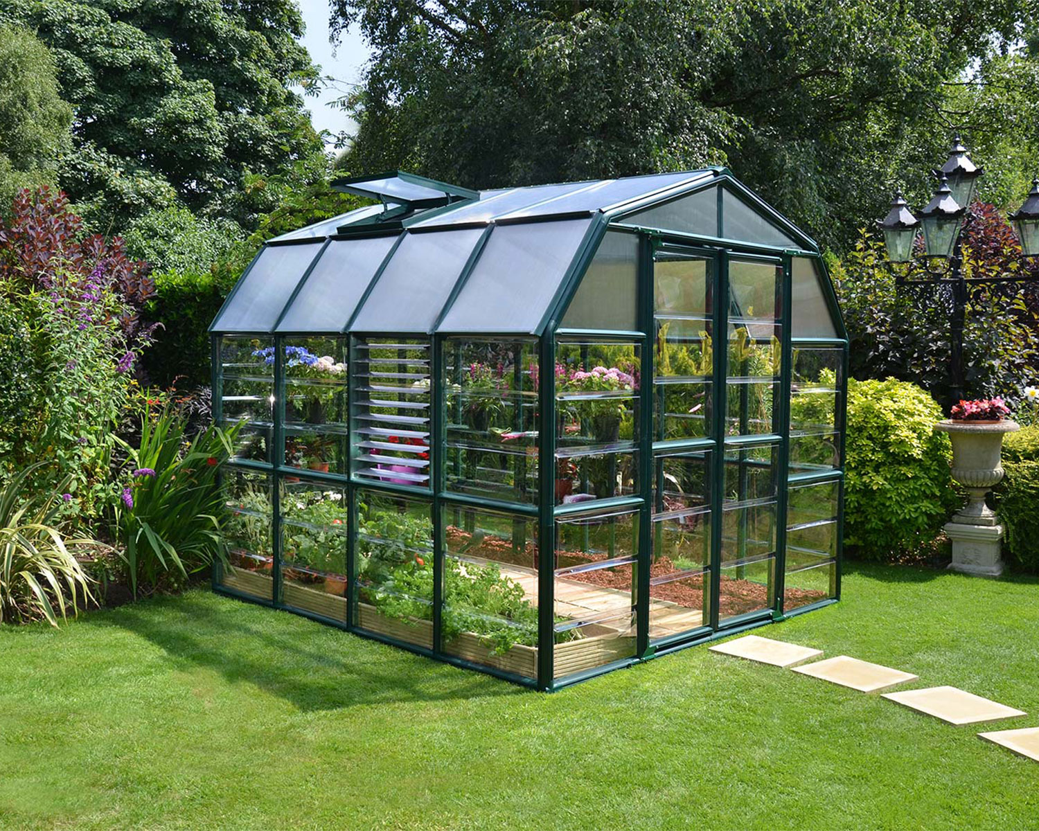 Snap &amp; Grow 6 ft. x 12 ft. Greenhouse Silver Structure &amp; Clear Panels on a lawn