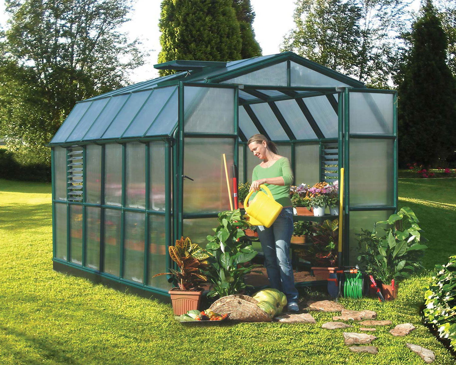 Greenhouse Prestige 8 ft. x 12 ft. Green Structure &amp; Twin Wall Panels watering plants