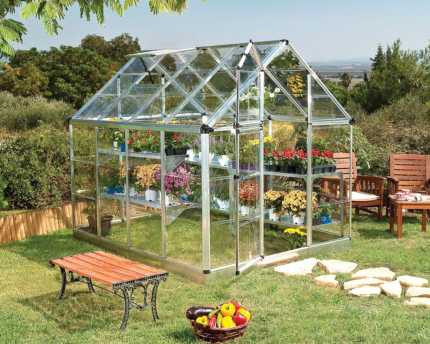 Snap &amp; Grow 6 ft. x 8 ft. Greenhouse Silver Structure &amp; Clear Panels on a lawn