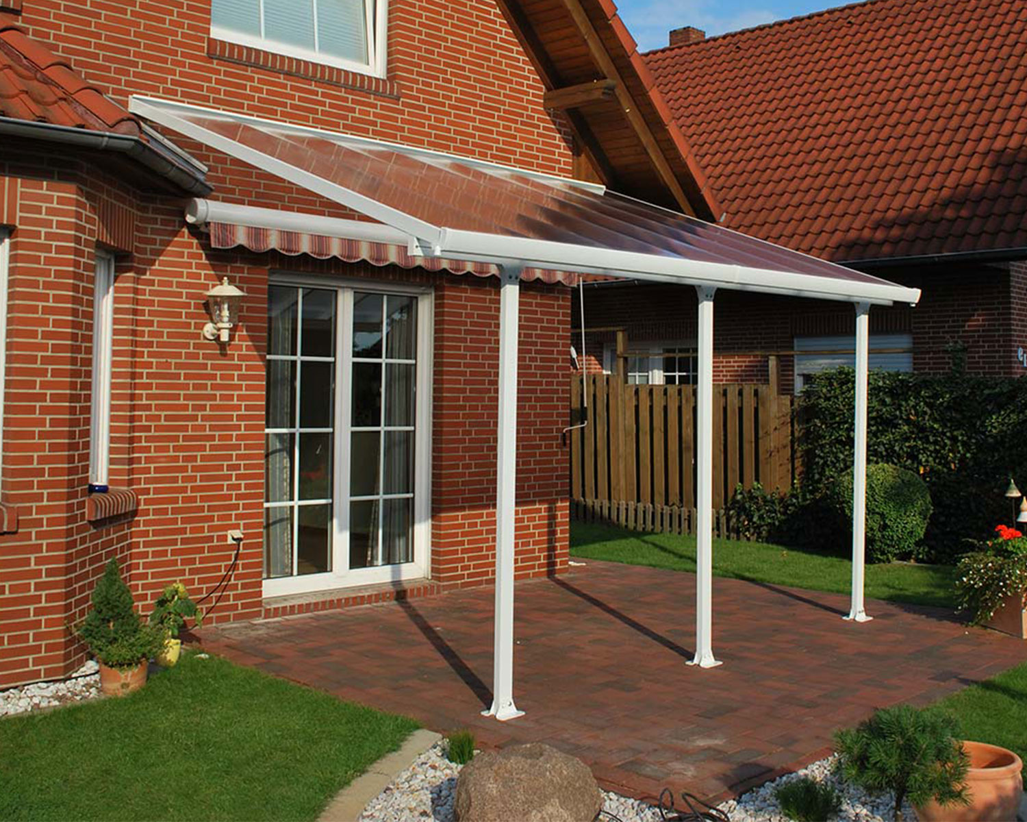 Patio Cover 10 ft. x 14 ft. White aluminum and polycarbonate roof panels attached to house