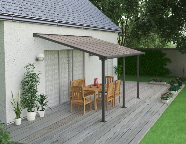 Grey Aluminium Patio Cover With Bronze-tinted twin-wall polycarbonate roof panels on Deck Patio protect garden furniture