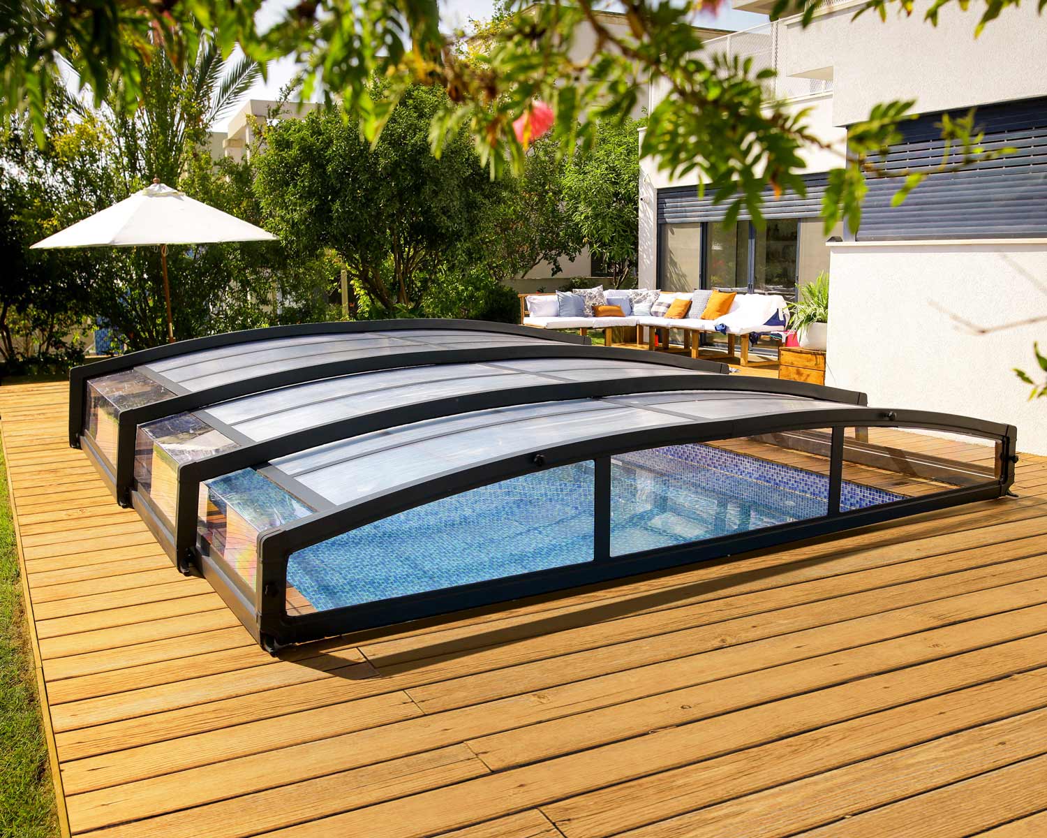 Grey Majorca pool enclosure, 19 ft x 13 ft, featuring a sleek design in an outdoor setting