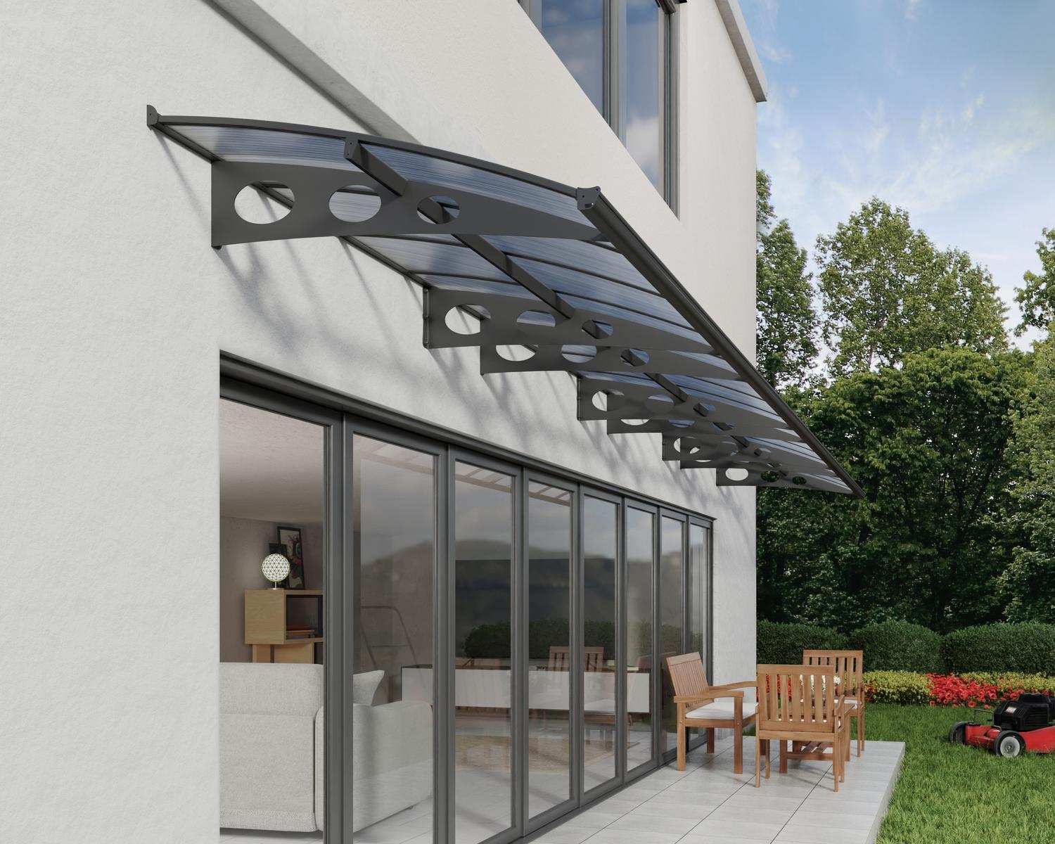 Sleek grey Herald door awning 5 ft x 29 ft featuring mist panels, stylishly positioned above a door