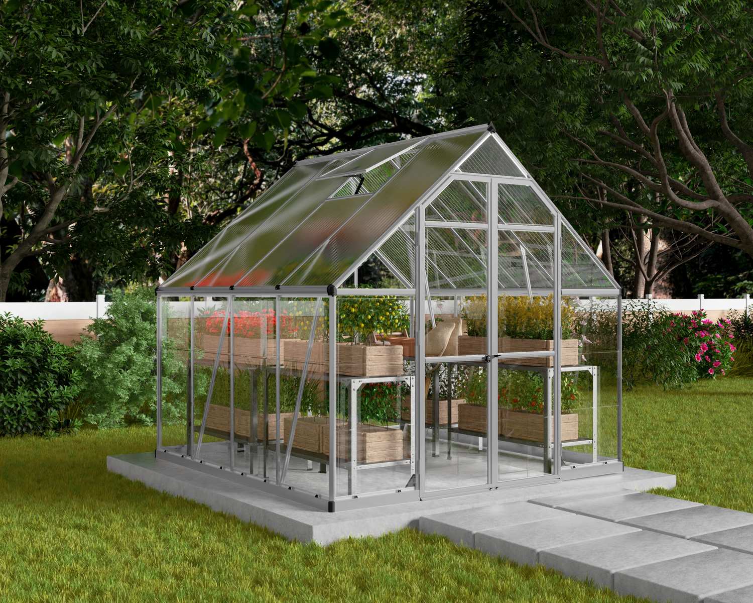 Balance 8ft x 8ft silver greenhouse with polycarbonate panels, steel frame, and plants, next to a white picket fence under a tree