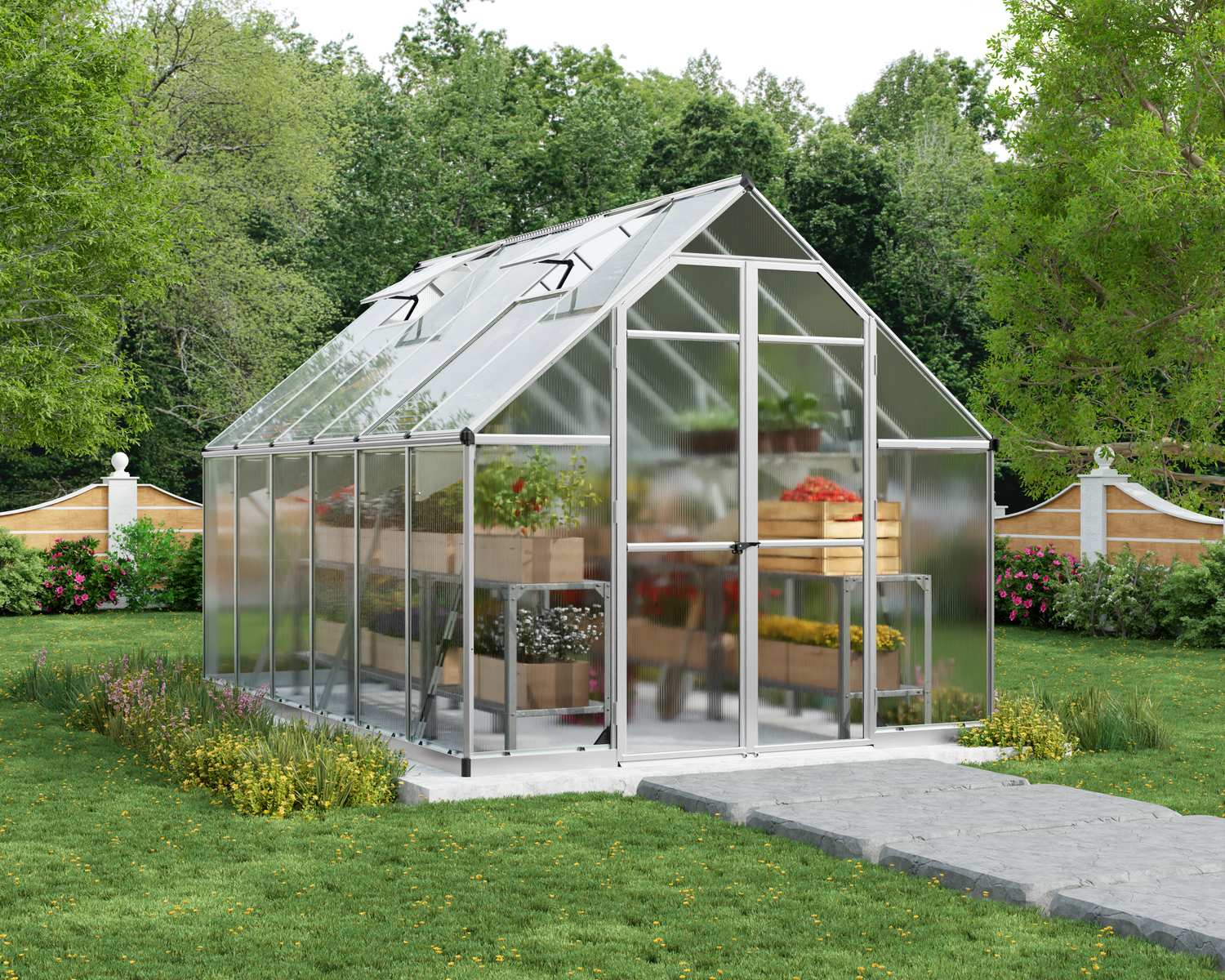 Essence 8x12 Silver greenhouse with polycarbonate panels, double doors, and a sloped roof, set in a vibrant garden