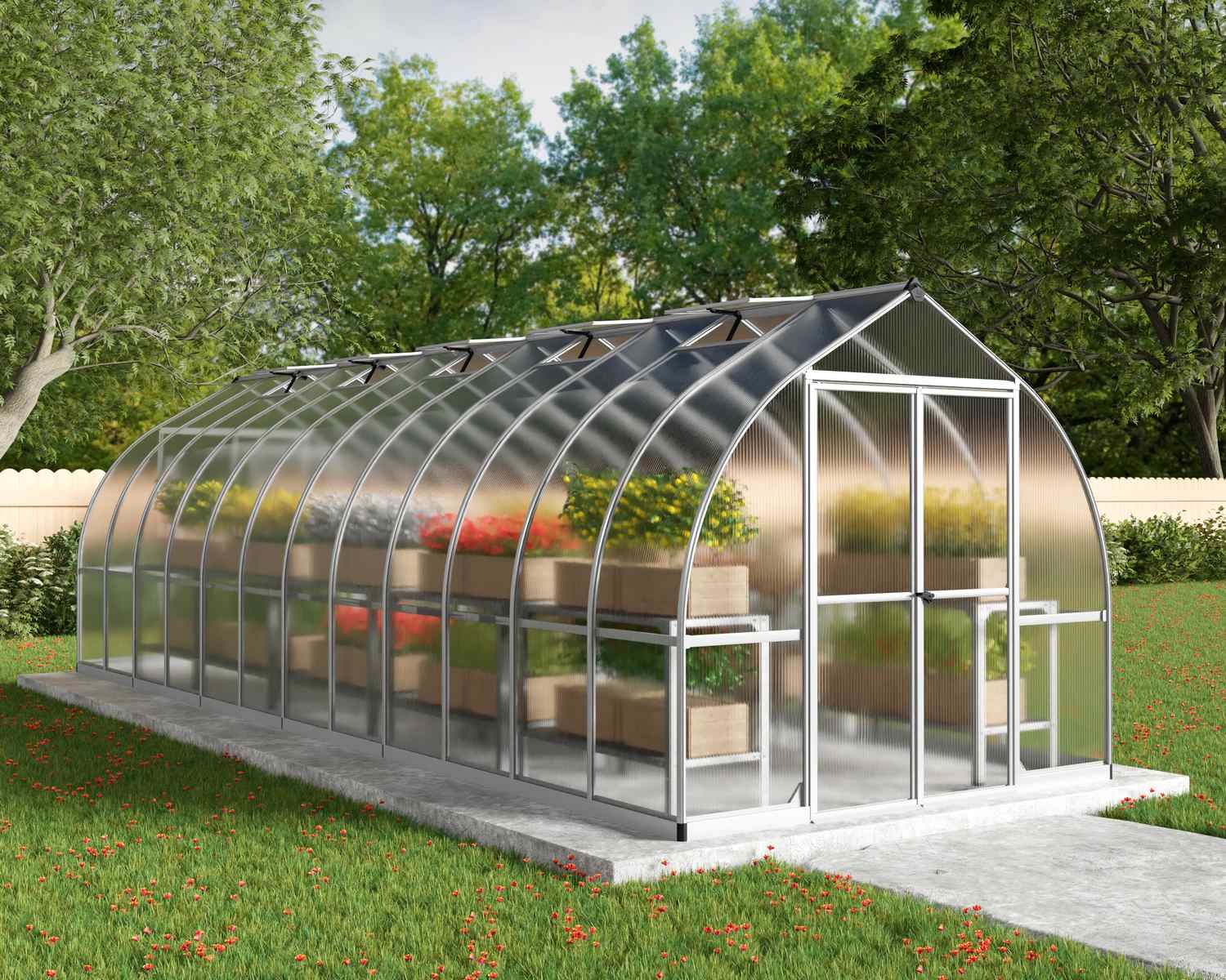 Bella 8x24 Silver greenhouse with polycarbonate multiwall panels, double doors, and a sloped roof, nestled in a vibrant backyard garden