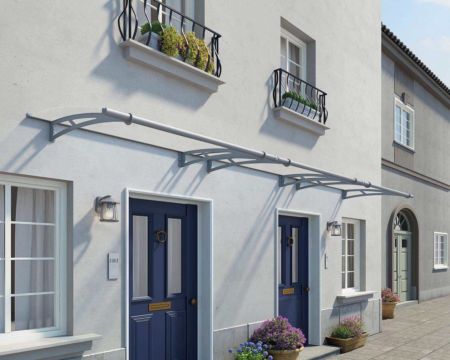 Modern silver Capella door awning 3 ft x 15 ft featuring clear panels, elegantly positioned above a door