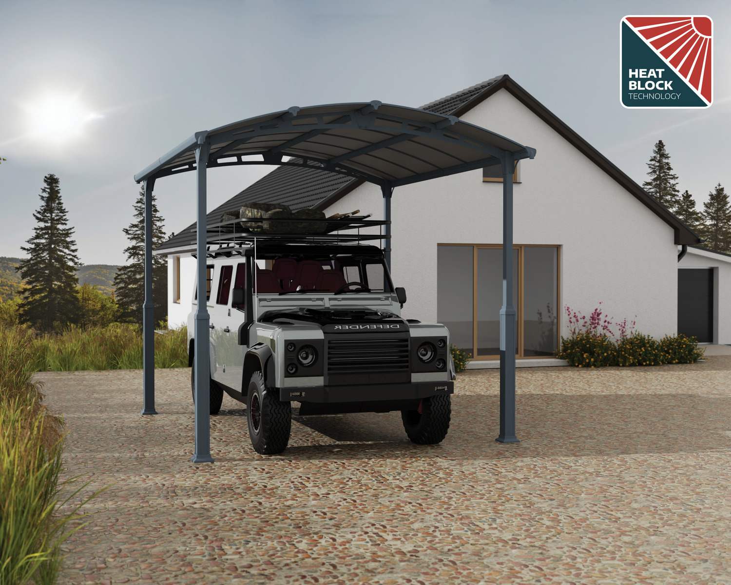 Grey 12ft x 14ft Alpine RV carport with an aluminium frame and polycarbonate roof, next to a modern house