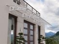 White Bordeaux 7m x 1.4m Door Canopy with clear polycarbonate panels, offering modern design and reliable protection for entryways