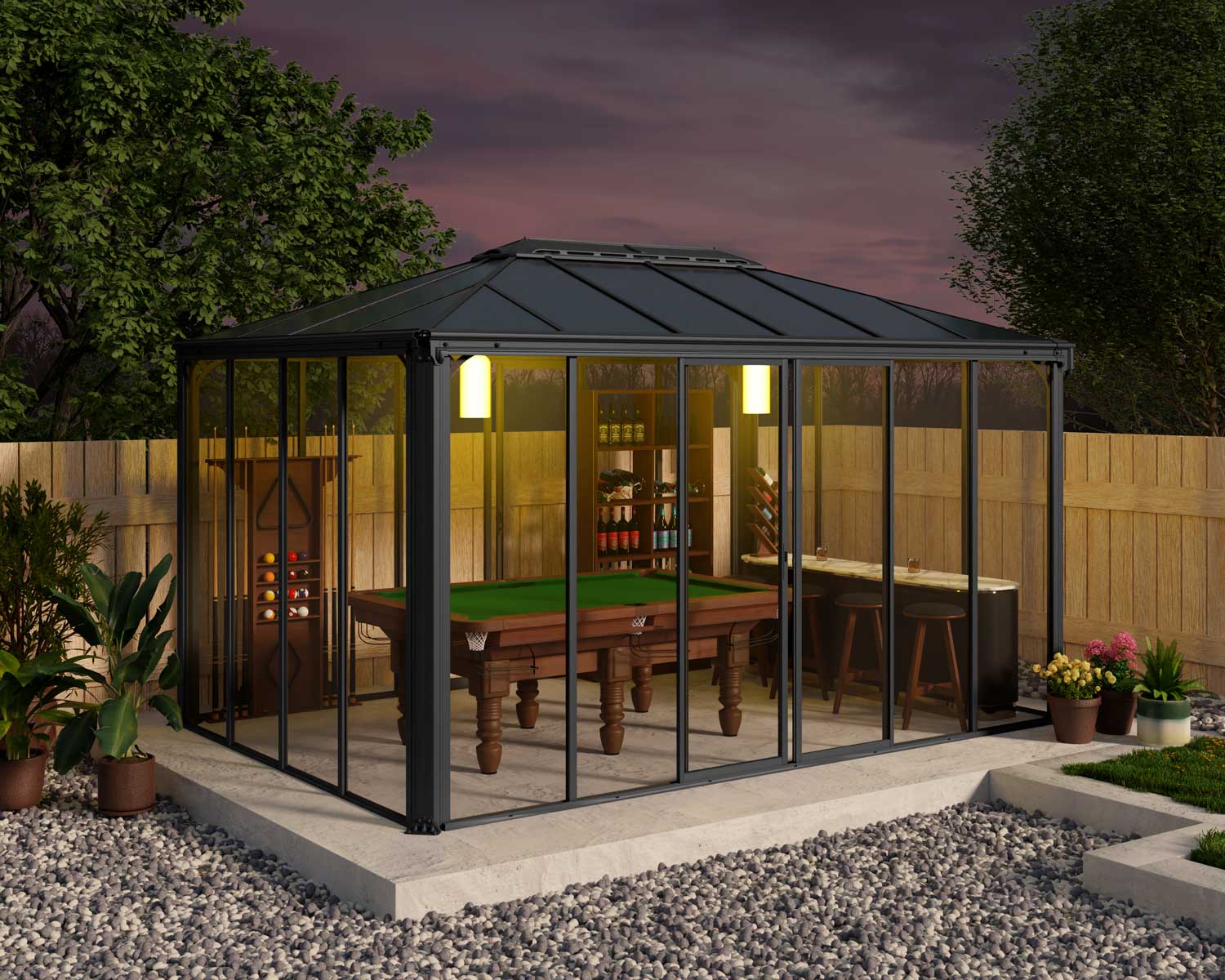 Ledro 3m x 4.3m grey enclosed gazebo with slanted roof, pool table, and surrounding garden at dusk