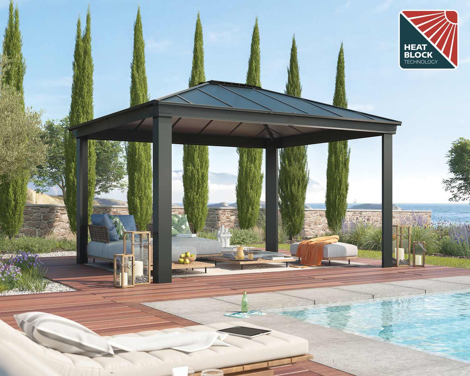 Grey Dallas 2.6m x 4.3m garden gazebo with polycarbonate roof and HeatBlock technology, with deck furniture by a pool and tall cypress trees